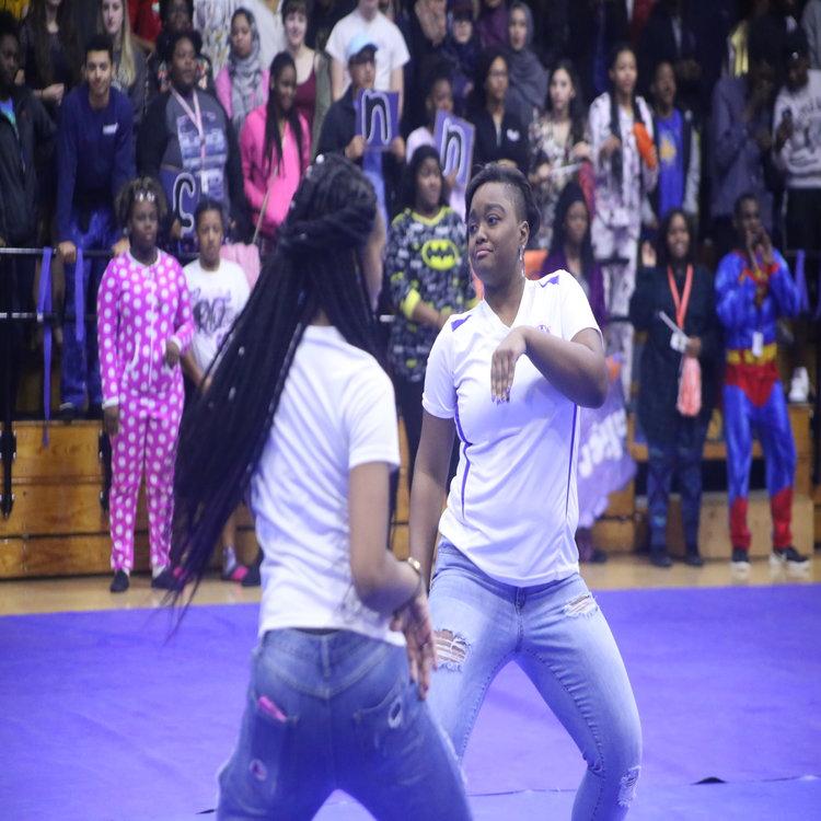 Breonia Dean and Faith Williams perform for color guard during the pep rally. 