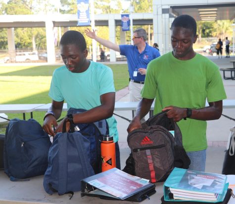 Adesina Famuyide, left, and Adedolapo Famuyide rummaged through their backpacks as they prepared to go through a metal detector. Richland School District Two piloted new safety persuasions at Richland Northeast on Wednesday, Sept. 21. 