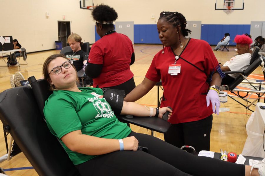 23 Hallie Palmer gives blood during the annual blood drive.  I was nervous, but thankful for the opportunity to give back to my community, Palmer said. 