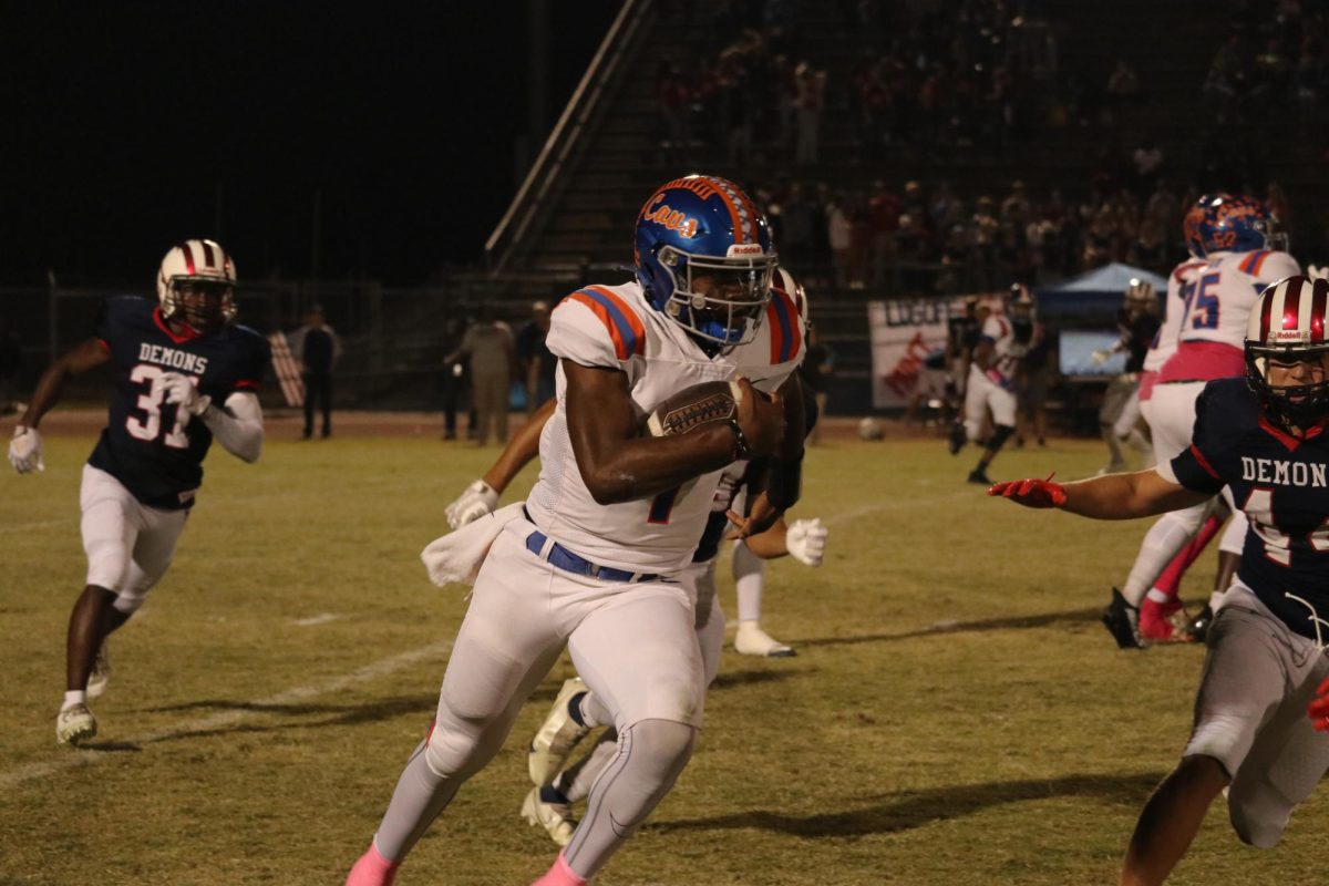 RNE quarterback Will Wilson gains yards during the Cavs 48-21 victory over Lugoff-Elgin on OCT. 13. Wilson has helped lift RNE to one of the best seasons in recent memory. 