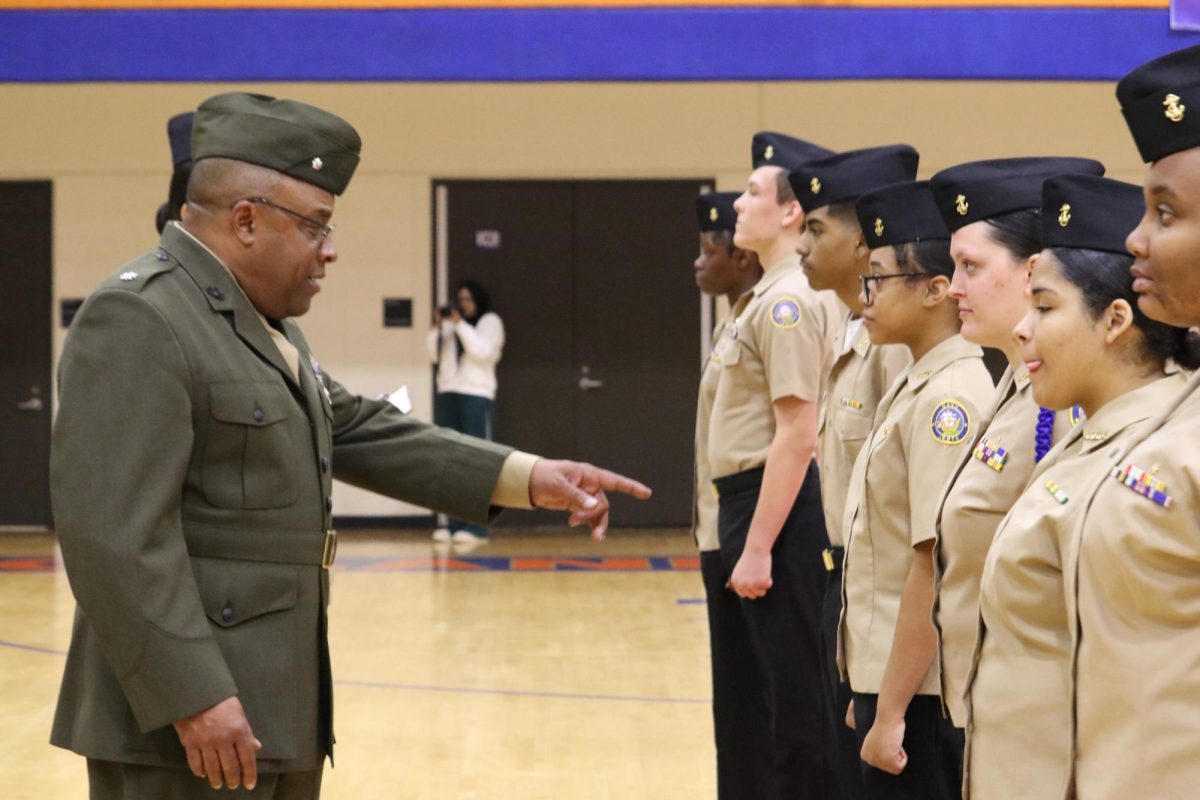 Lt. Col. Clark inspects cadets uniforms. Uniform inspection is one of the most important parts of the inspection, and can determine whether the unit will pass or fail.