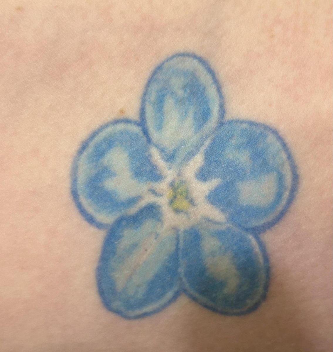 A+picture+taken+by+Brooke+Crigger+herself+of+the+forget-me-not+that+represents+her+grandmother.+In+the+future%2C+shes+going+to+get+more+flower+tattoos+to+memorialize+different+members+of+her+family.
