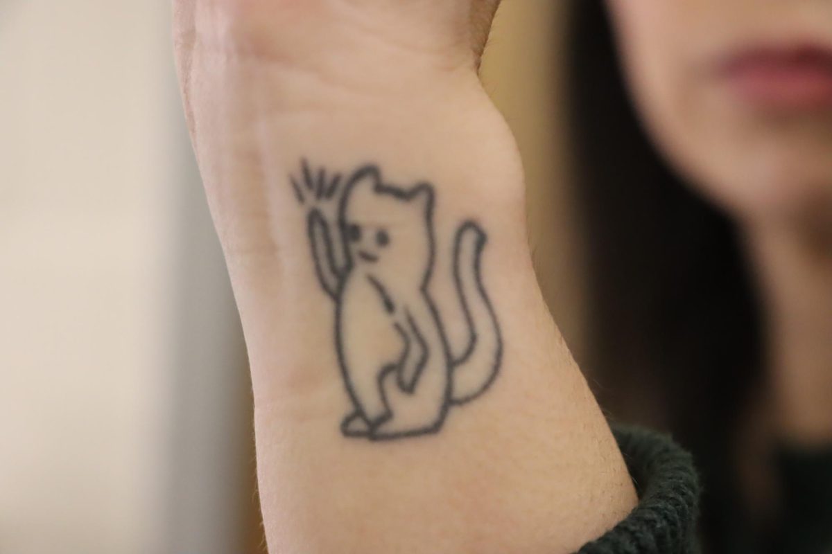 Fluellens+cat+tattoo+on+her+wrist%2C+which+matches+with+her+sisters.