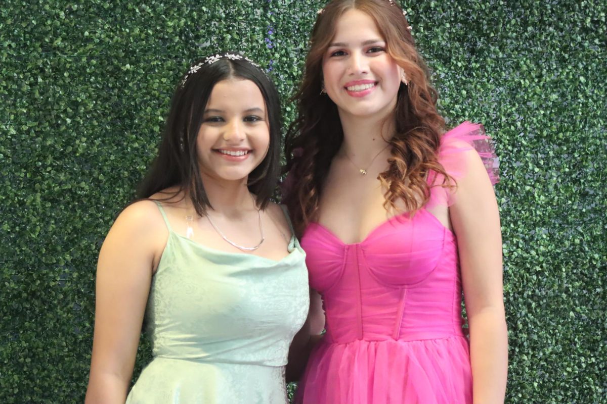 Newly elected Senior President Dulce Calix-Echeverria and Senior Vice President Skylar Hillier pose for a prom photo. Both helped Junior House organize the event.