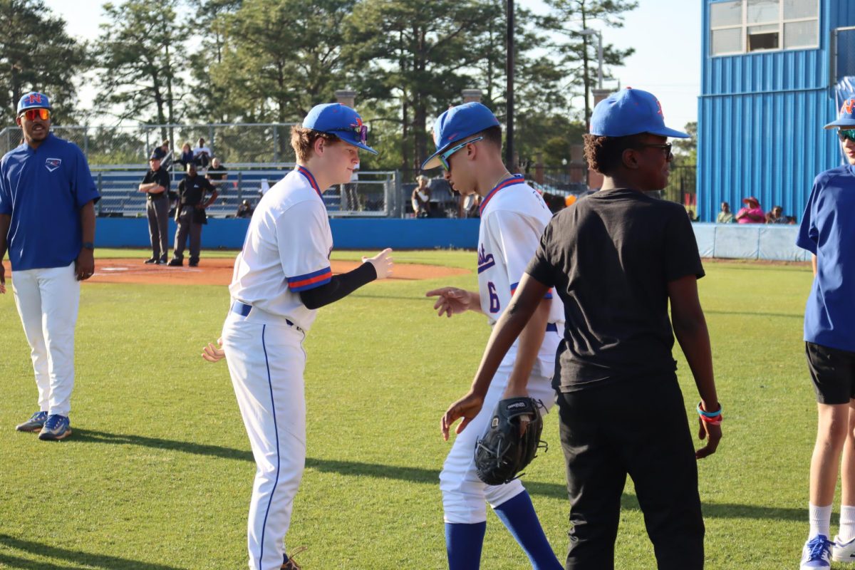 Amari Smith and Connor Edmunds do pre-game handshake.