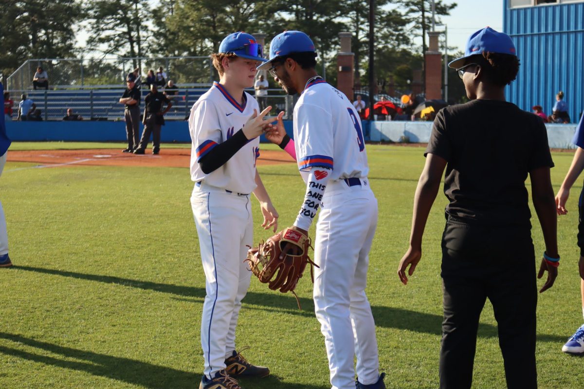 Connor Edmunds And Diego Rodriguez-Rivera do their pre-game handshake. 