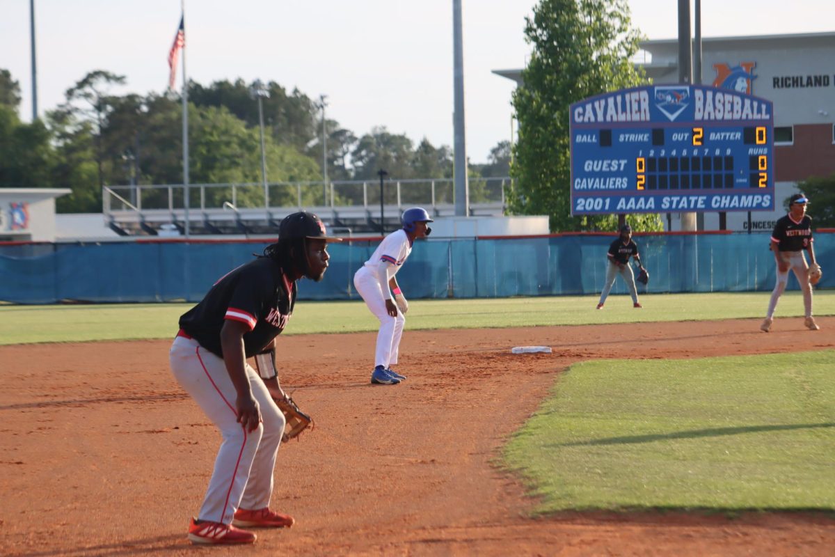RNE player takes a lead off of second base, during Westwood v. RNE game. 