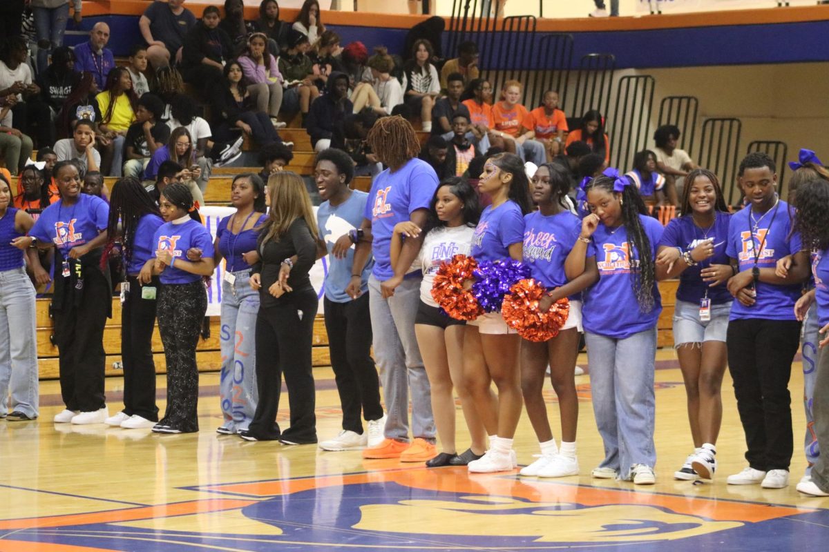 To finish the pep rally, Student government and the football team sing the alma mater with the crowd. 