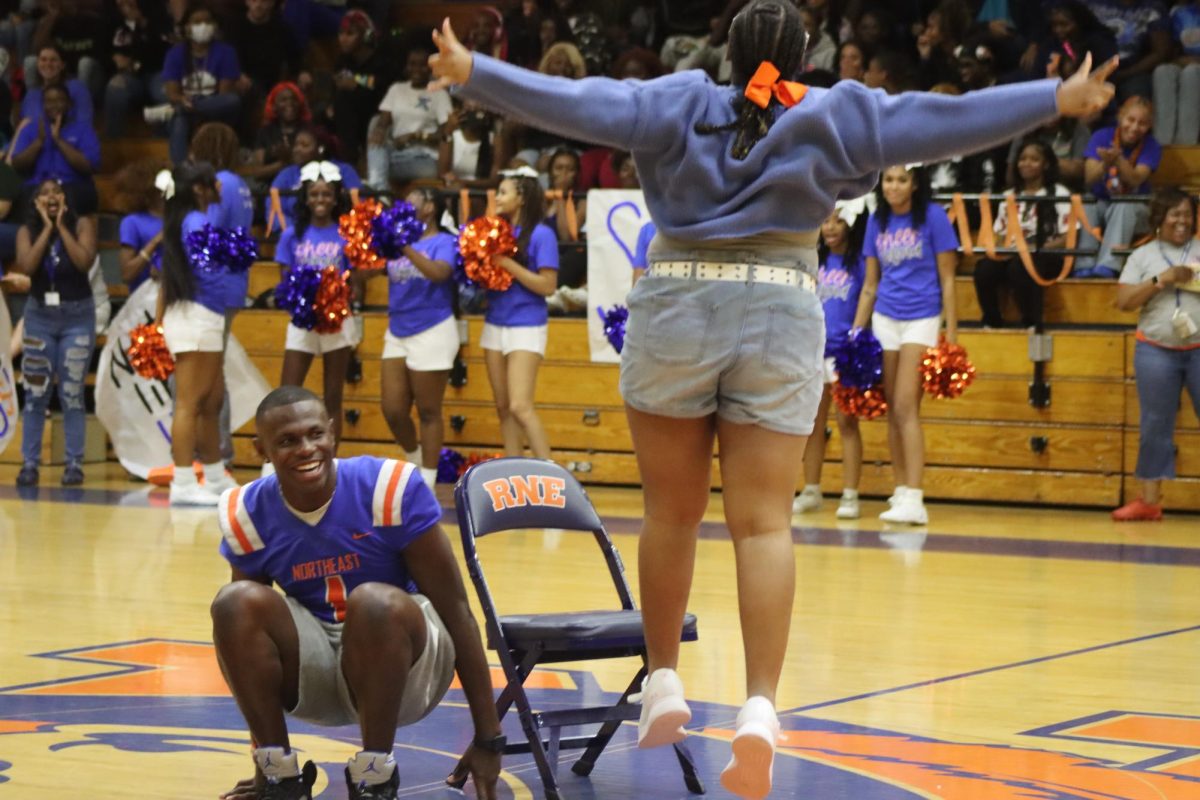 After winning a game of musical chairs, the winner does a celebratory dance.