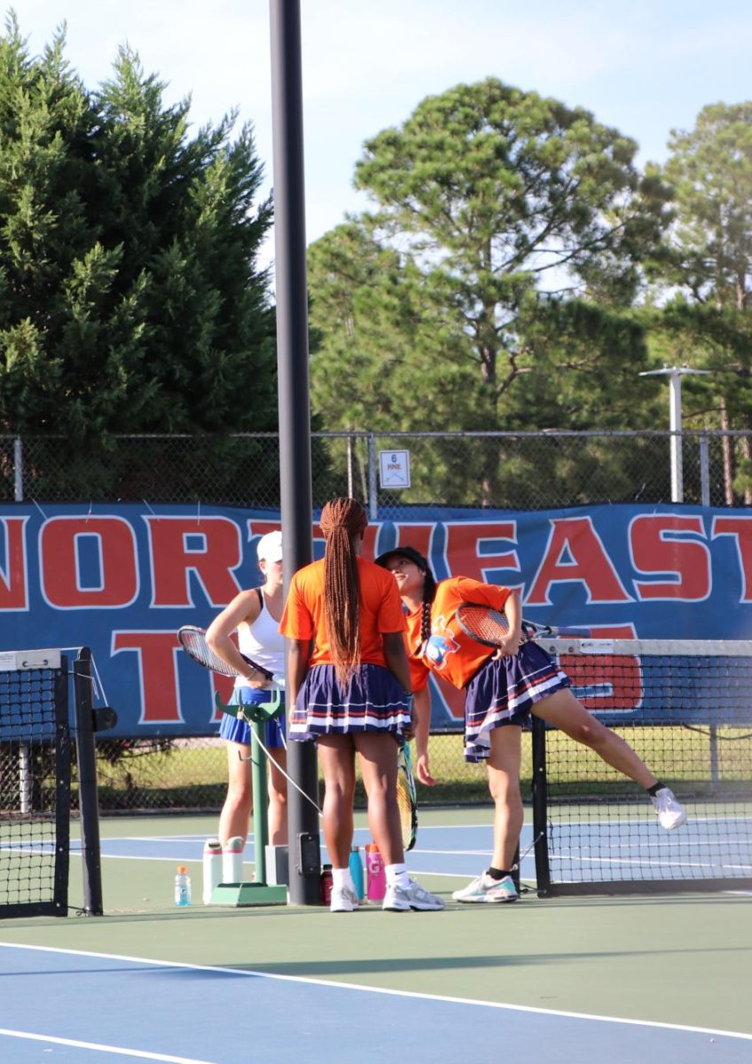 Juniors Malia Johnson and Fabiola Gutierrez-Morente take a water break with opponents.