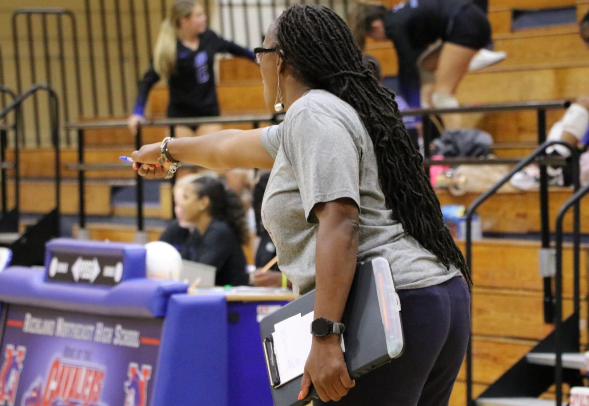 Jacqueline Kershaw coaches JV players from the sidelines.