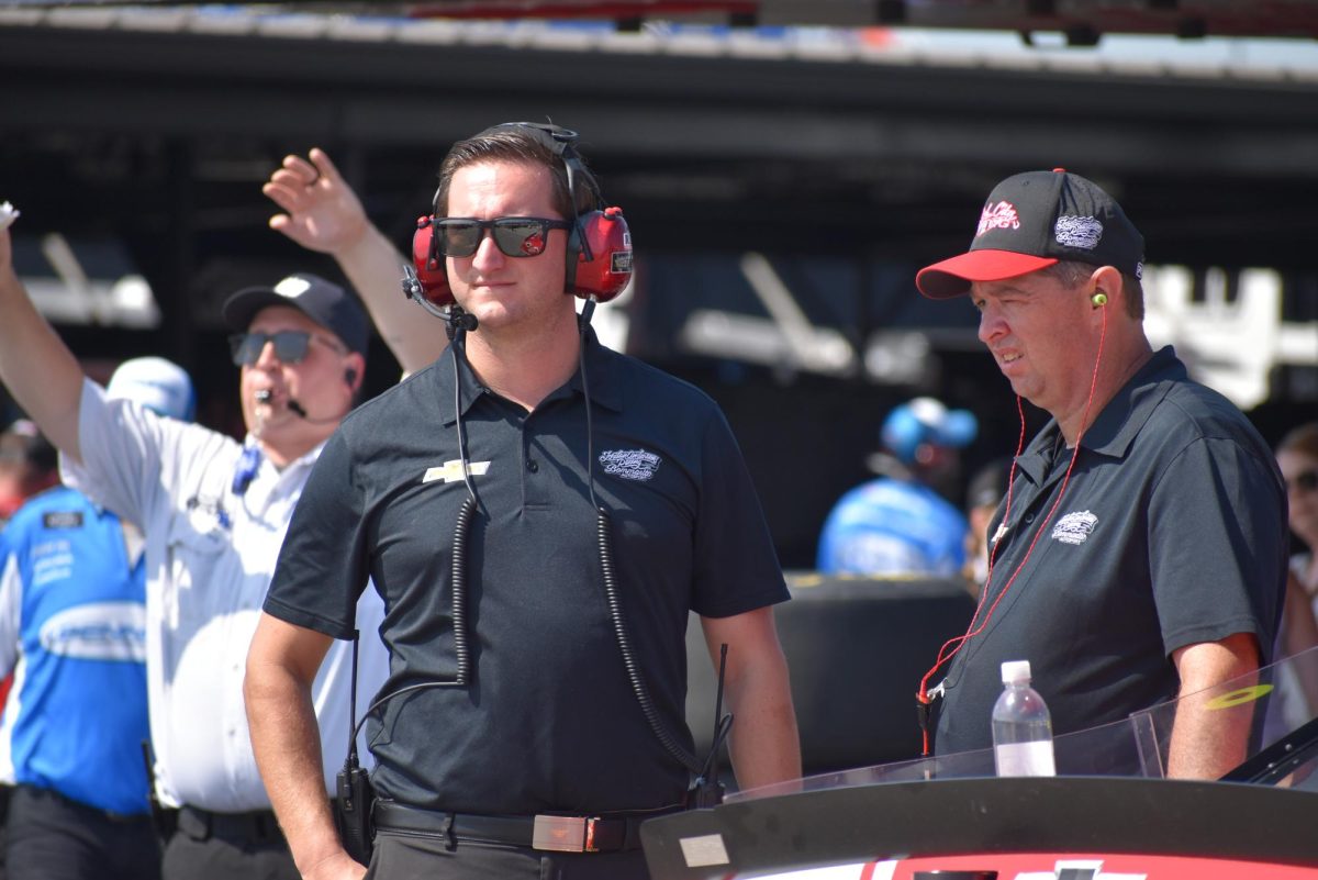 Jordan Anderson watches cars pull into the garage.