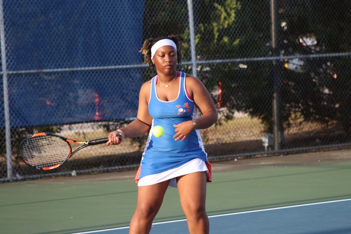 Journey Schofield hits the ball during her match.