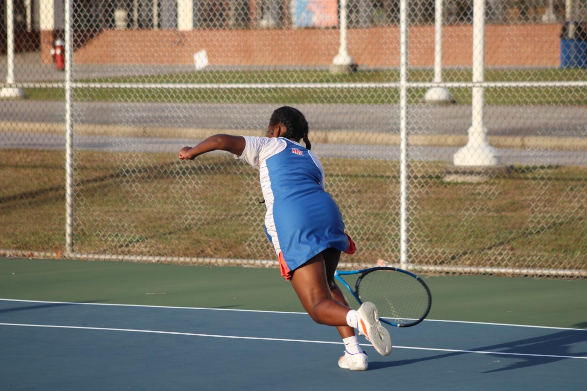 Allison King-Turner dives for a ball during her match.