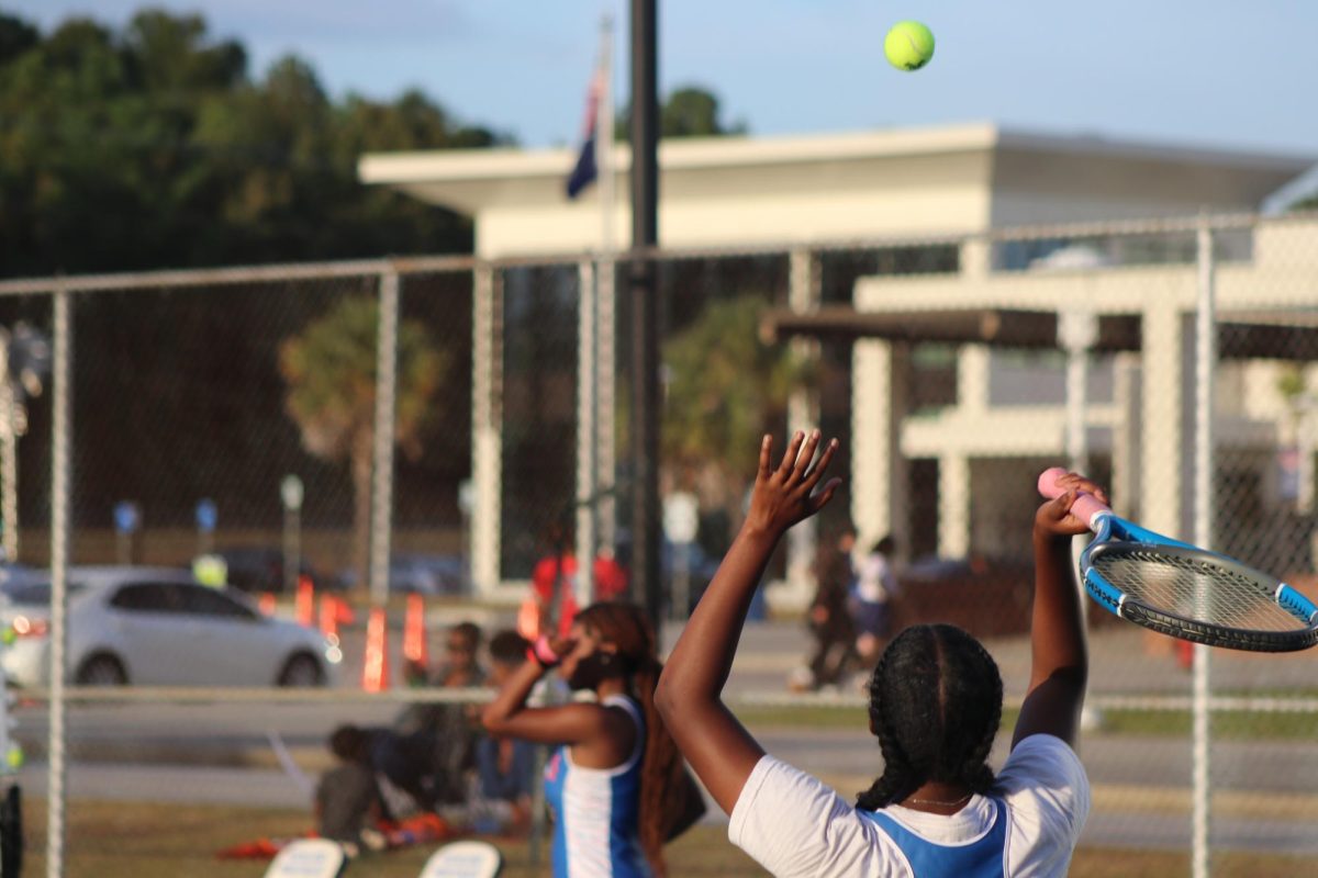 Sophomore Allison King-Turner serves the ball to start a game.