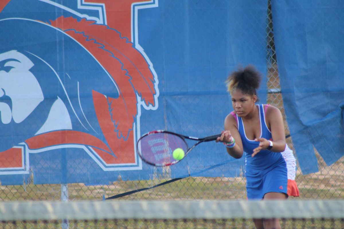 Freshman Destiny Thompson returns the ball.