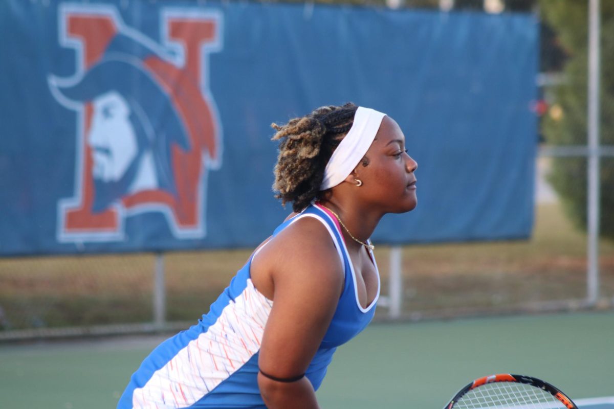 Journey Schofield waits for her opponent to return the ball.