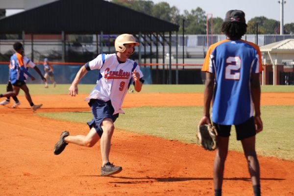 Baseball alumni rounds third base hoping to make it to home base. 