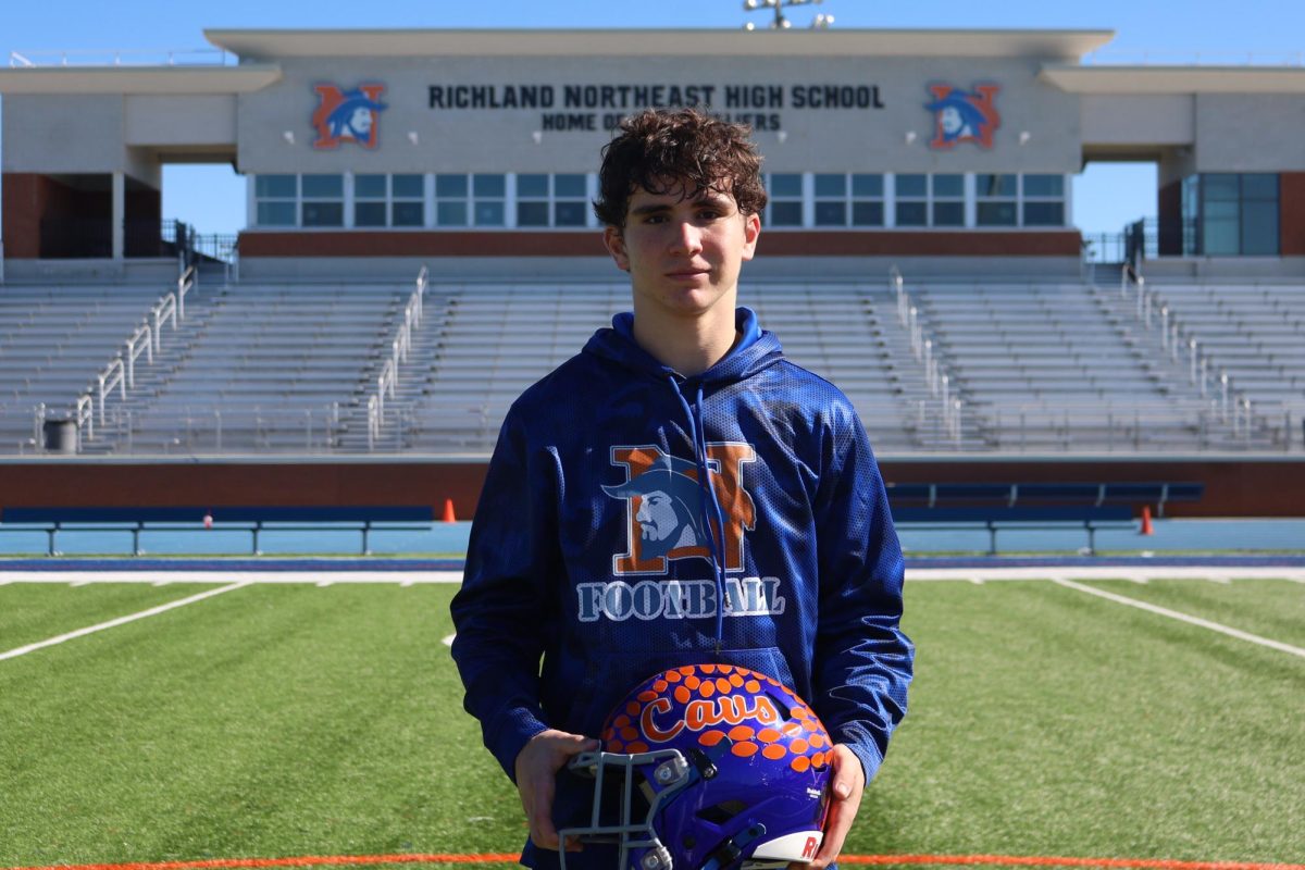 Junior wide receiver Blake Betette stands on the football field before leaving for the first round playoff game.