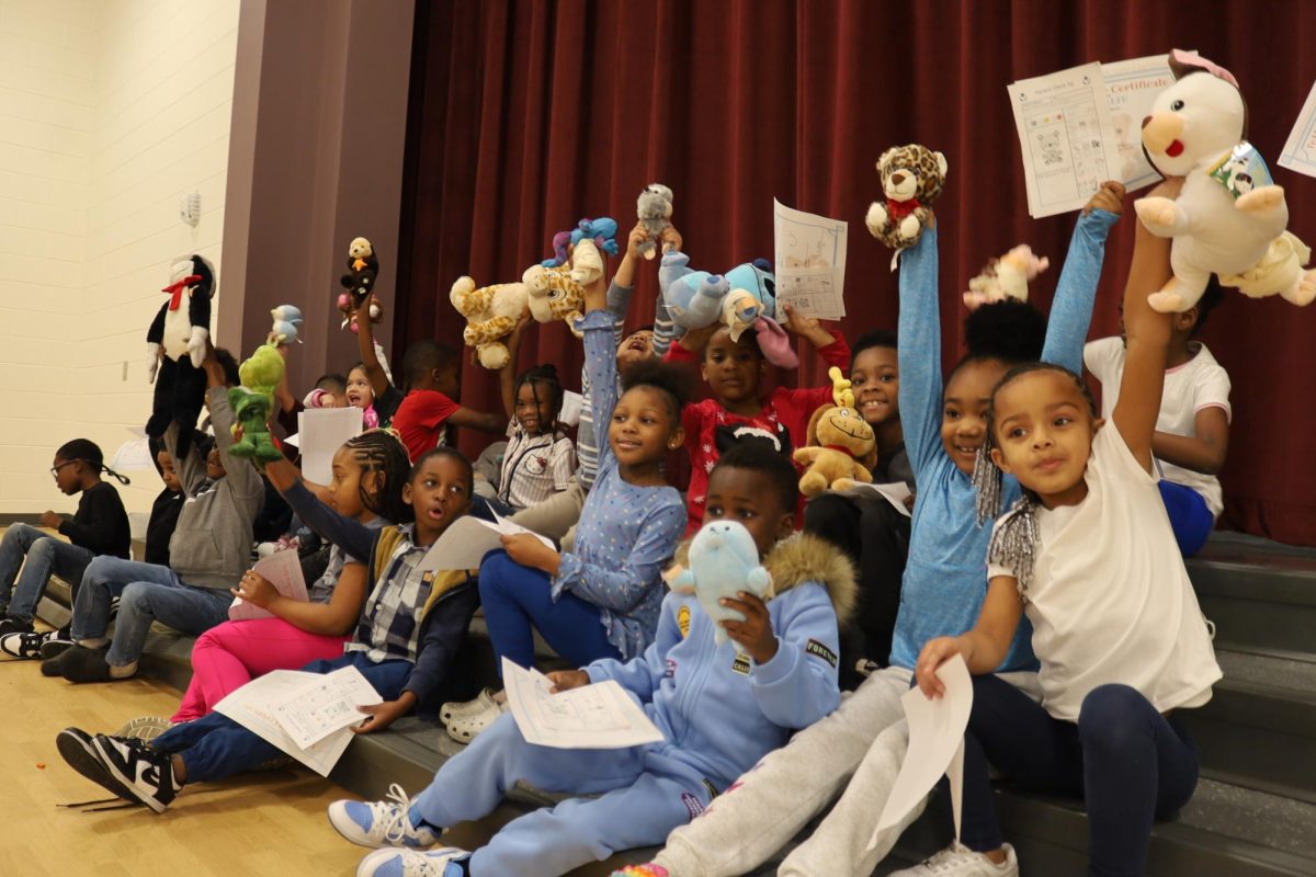 Kids celebrating with their healthy stuffed animals and certificates for completing the Teddy bear Clinic. 