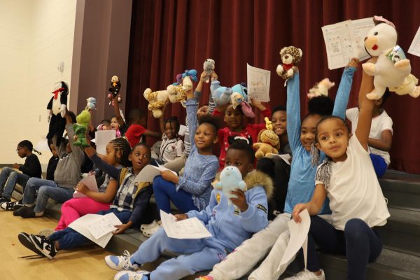 Kids celebrating with their healthy stuffed animals and certificates for completing the Teddy bear Clinic. 