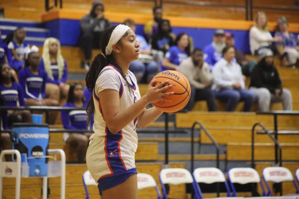 Sophomore Melanie Walker attempts to pass the ball.