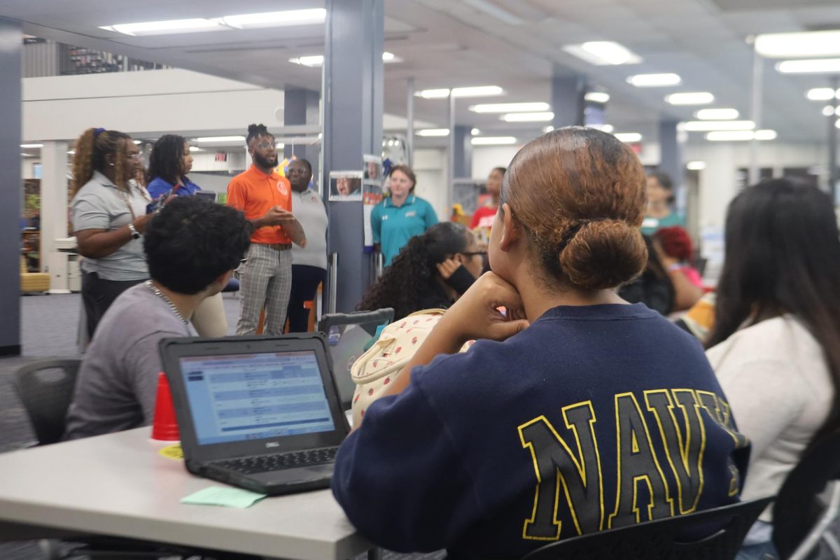 On August 21, seniors listen to college representatives during College Application Day in the Media Center.
