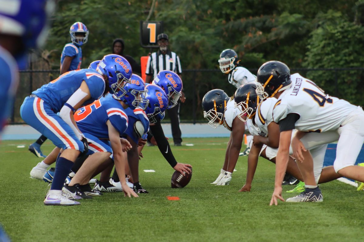 Offense waits for the quarterback pre snap.