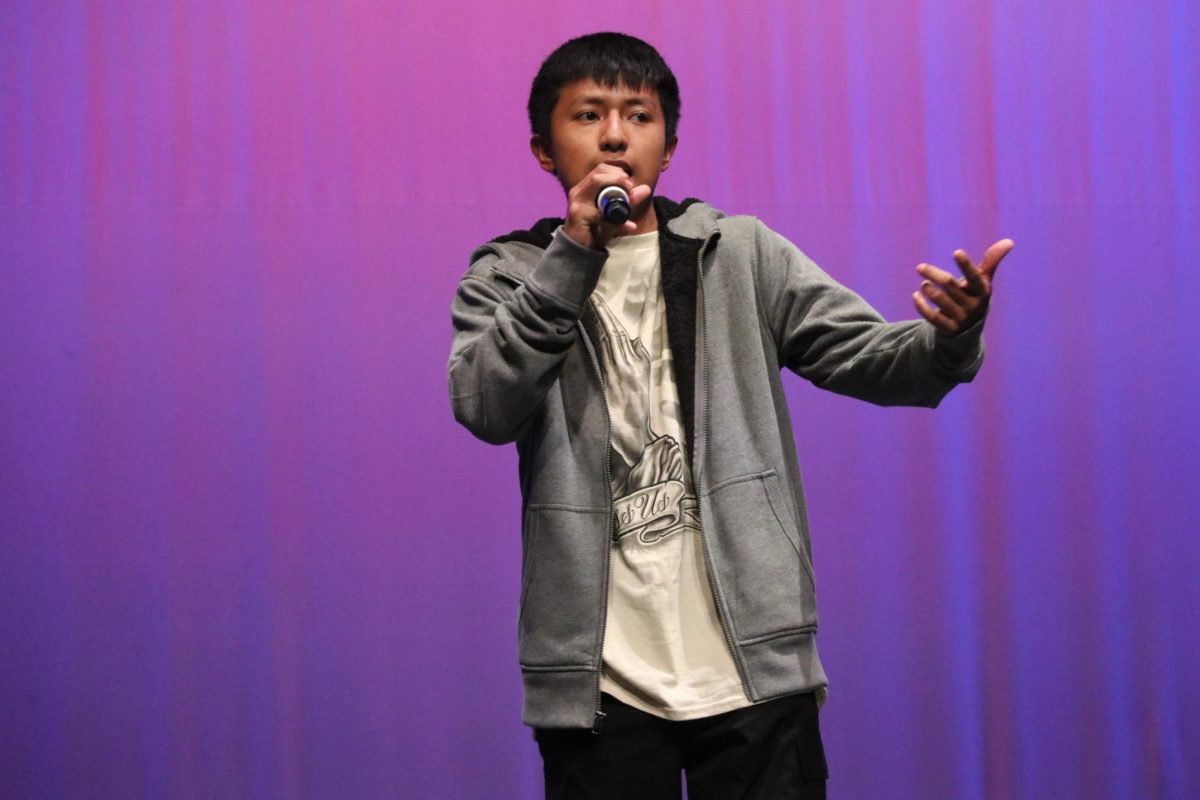 Harry Tecalco Bravo, junior, raps.