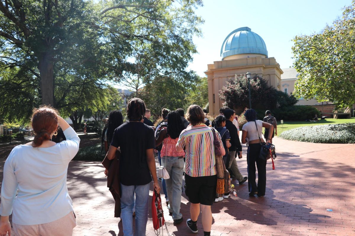 Journalism students walk back to the bus after the awards ceremony. 