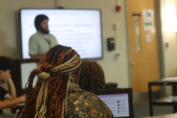 In psychology, a student takes notes on a lesson by Samuel Sims.