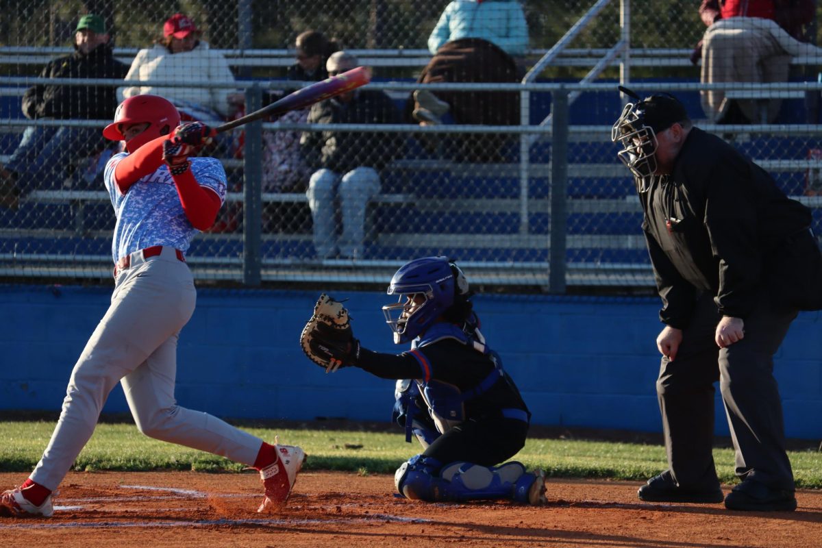 Eighth grader Josh Smalls catches a strike from Jake Peck.
